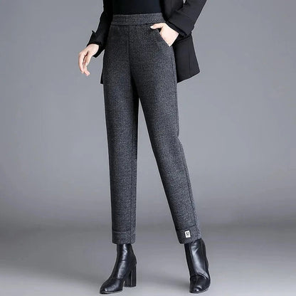 Chic women's herringbone tailored trousers, a high-waist design offering a sophisticated look for workwear.