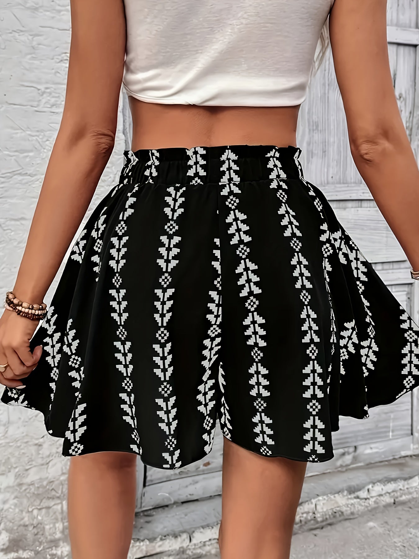 Summer-ready women's boho flare shorts with a comfortable high-rise and stylish geometric print.