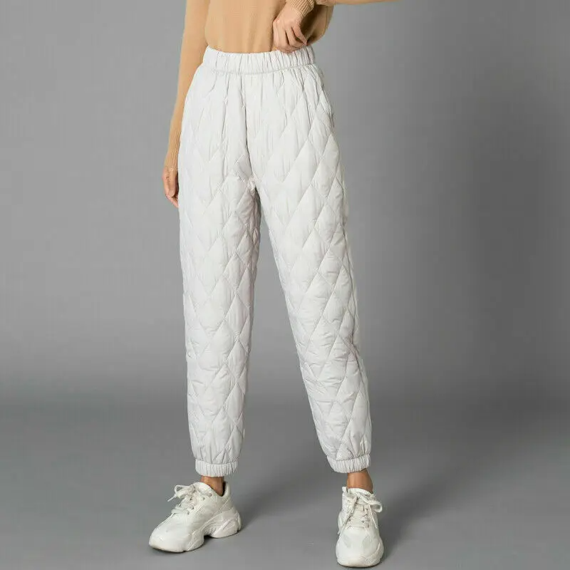 Warm women's puffer joggers with stretch waist, perfect for comfortable loungewear.