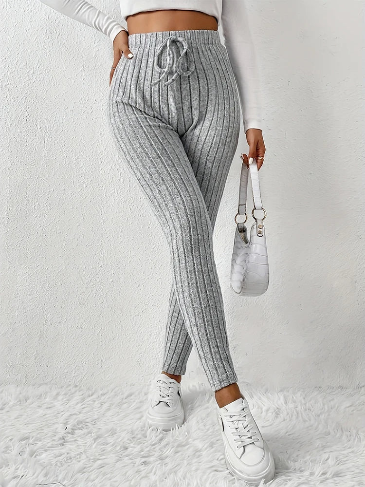 Close-up of trendy ribbed design on women's high-rise leggings, showcasing texture and quality stretch.