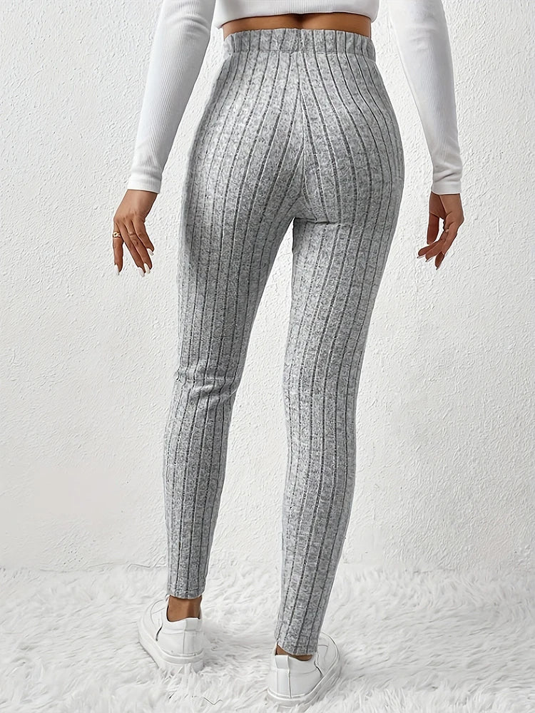 Stylish women's high-rise ribbed leggings, offering a slim fit & all-day comfort for versatile everyday fashion.