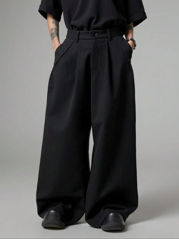 Woman modeling high-rise wide-leg tailored trousers, showcasing the elegant drape and professional style.