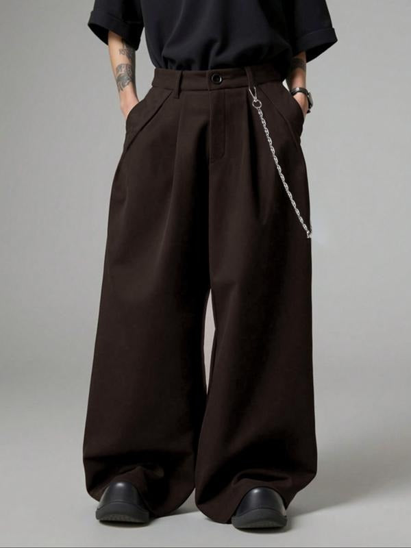 Side view of women's pleated wide-leg tailored trousers, styled for an elegant and comfortable silhouette.