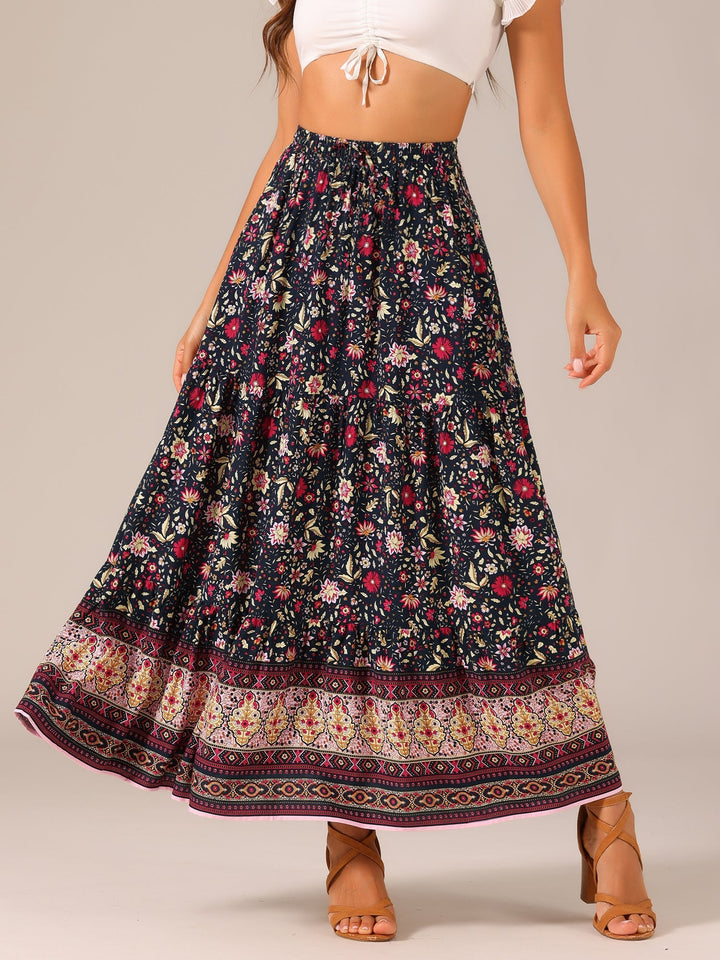 Vacation wear: flowing printed maxi skirt, high waist, and trendy side slit for resort fashion.