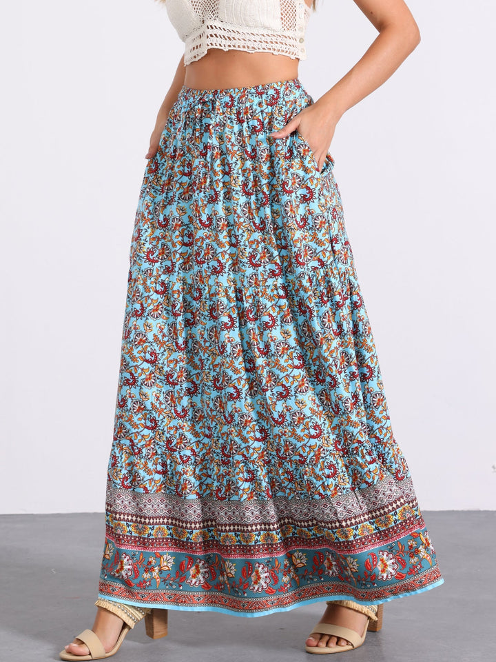 Women's high waist flowing maxi skirt with a captivating print and a smart side slit.