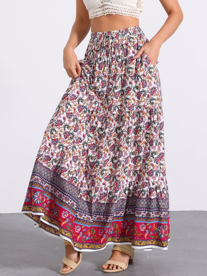 Elegant high waist printed maxi skirt with a generous side slit, flowing for resort style.