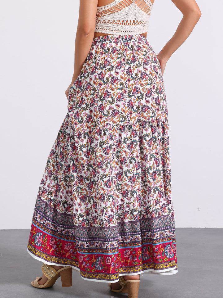 Women's vacation maxi skirt, high waist, flowing printed fabric, featuring a chic side slit.