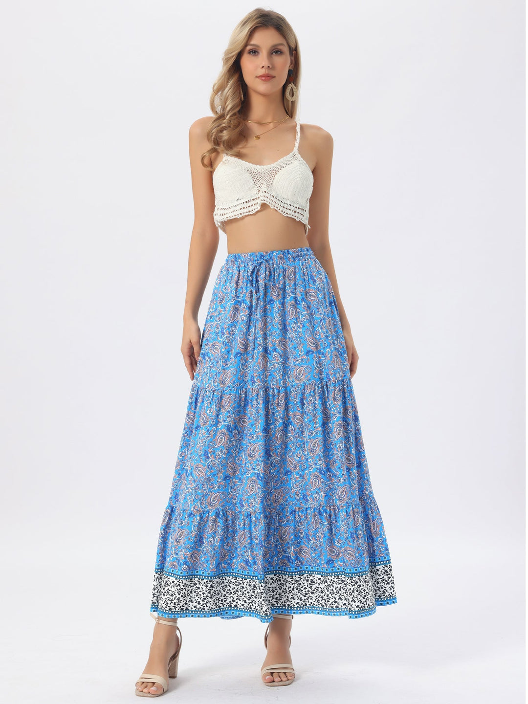 Flowing printed high waist maxi skirt, versatile for day or evening, with a graceful side slit.