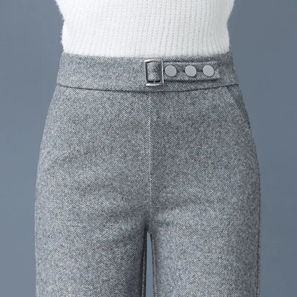 Women's High-Waist Tailored Astoria Pants in chic gray herringbone fabric with a sophisticated statement belt.