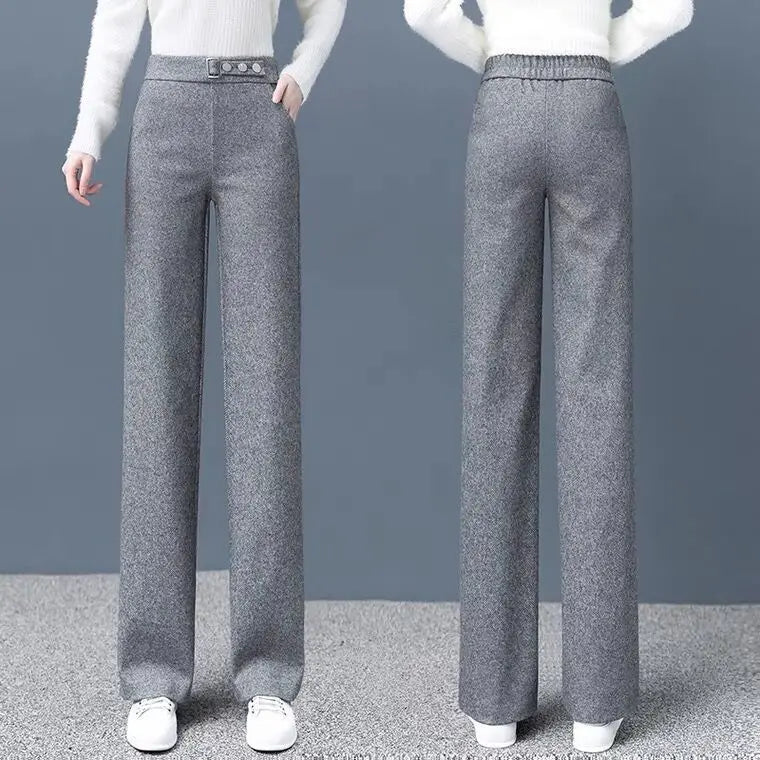 Sophisticated khaki Women's High-Waist Tailored Astoria Pants with a prominent statement belt for a chic look.