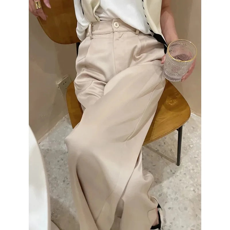 Full-length women's high waist wide leg pants, creating an elegant, flowy silhouette.