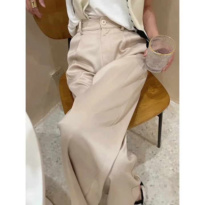 Full-length women's high waist wide leg pants, creating an elegant, flowy silhouette.
