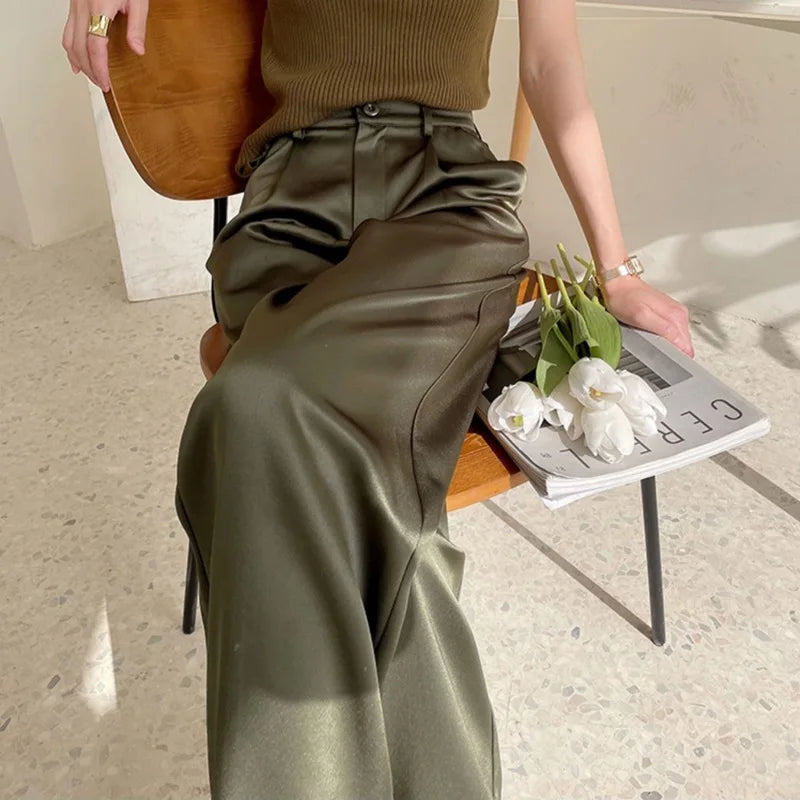 Close-up of elegant women's high waist wide leg flowy pants, showcasing soft fabric.