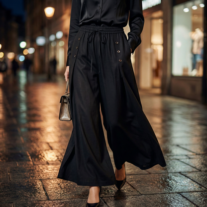 Close-up of comfortable women's high-waist wide-leg pants featuring a practical drawstring for a relaxed, adjustable fit.