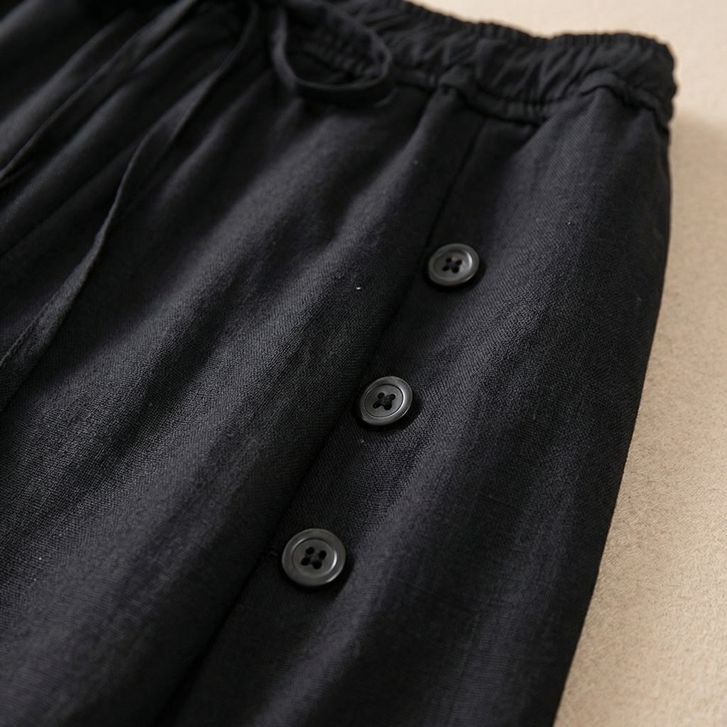 Back view of women's high-waist wide-leg pants, emphasizing the comfortable, relaxed fit and stylish, flowy silhouette.