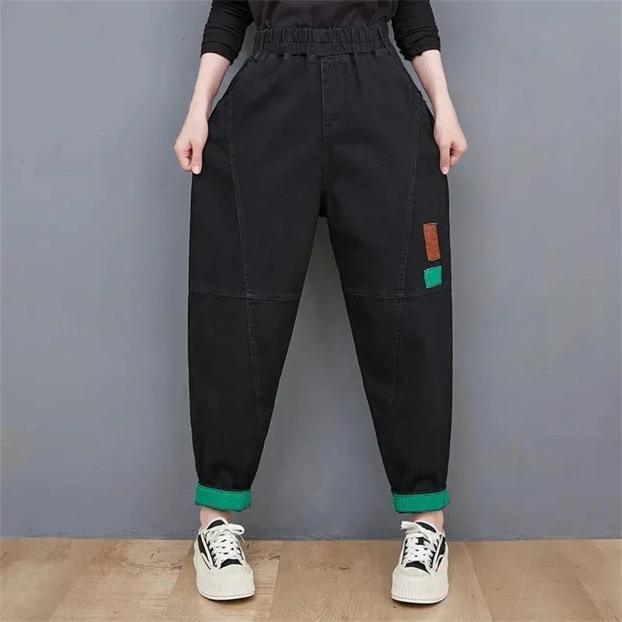 Chic women's plus size high-waisted baggy jeans with a relaxed, oversized fit & ankle-length design.