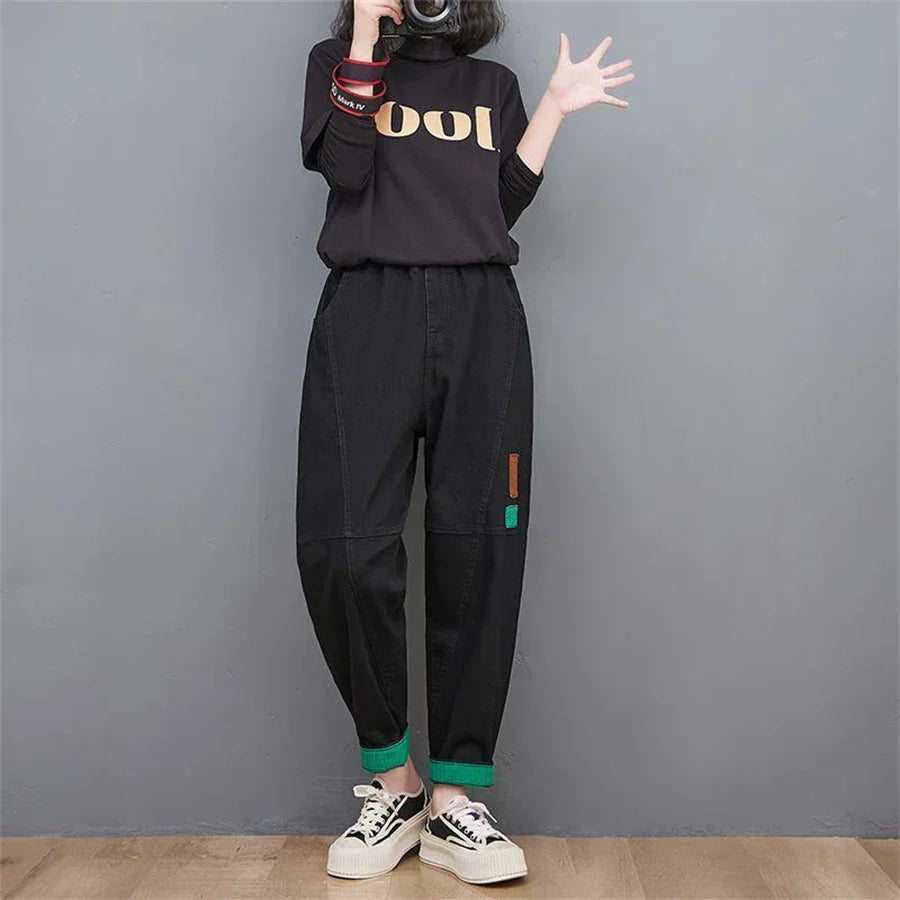 Retro-inspired women's loose-fit denim jeans; high-waisted, baggy, oversized, & cropped at the ankle.