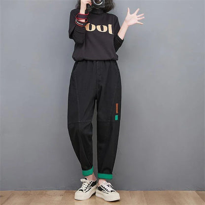 Retro-inspired women's loose-fit denim jeans; high-waisted, baggy, oversized, & cropped at the ankle.