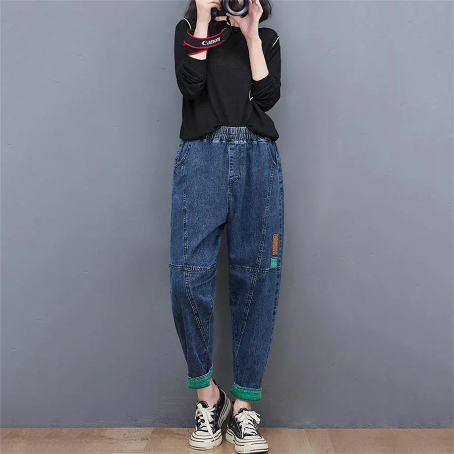 Model wearing comfortable high-waisted baggy oversized ankle jeans, showcasing the loose, retro fit.