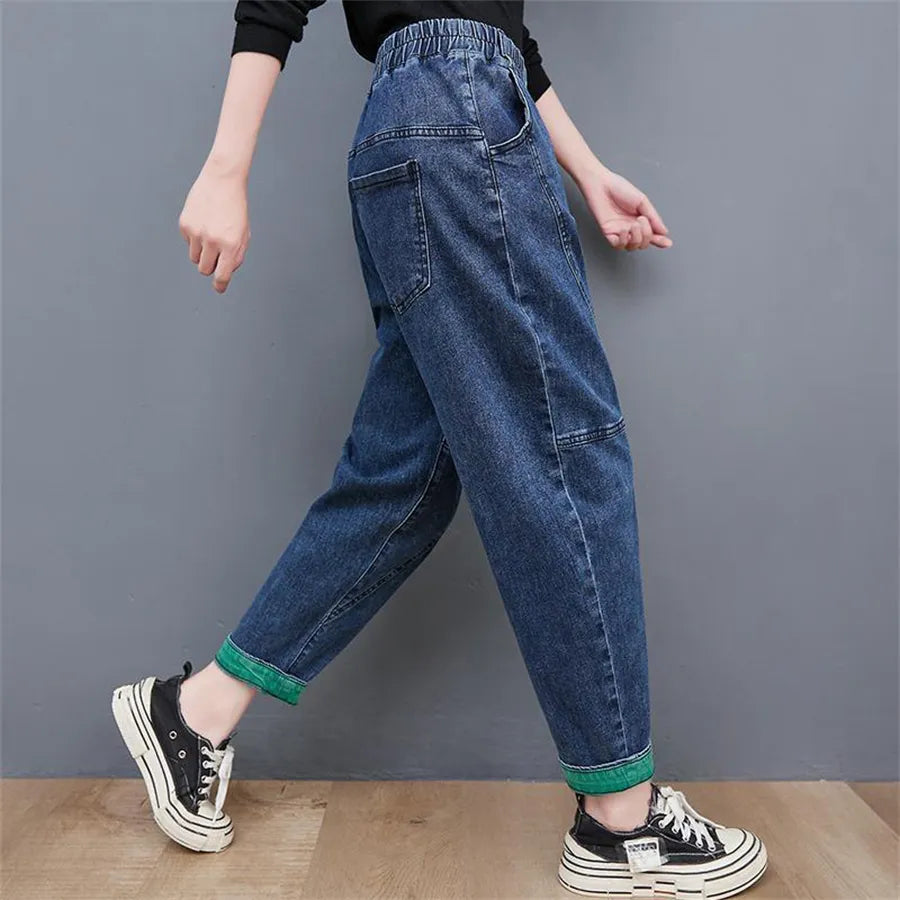 Front view of women's plus size high-waisted baggy ankle jeans, highlighting the oversized, casual fit.