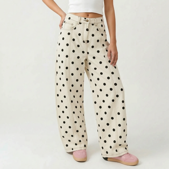 Women's high-waisted barrel trousers with a playful dotted print. Comfortable, relaxed fit for casual chic fashion.