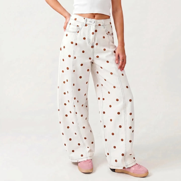 Spring/summer women's high-waisted barrel pants featuring a charming dotted print. Relaxed fit for effortless style.
