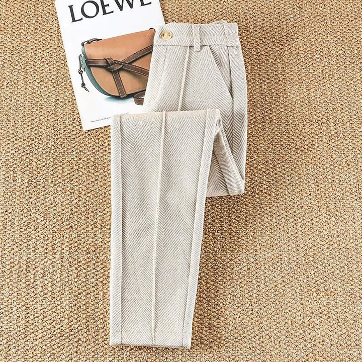 Tailored high-waisted herringbone trousers for women, featuring a chic pencil fit, versatile & stylish.