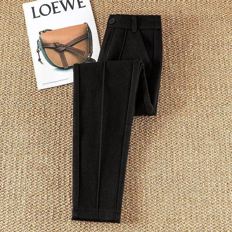Versatile women's high-waisted tailored herringbone pants, suitable for officewear or dressy events.