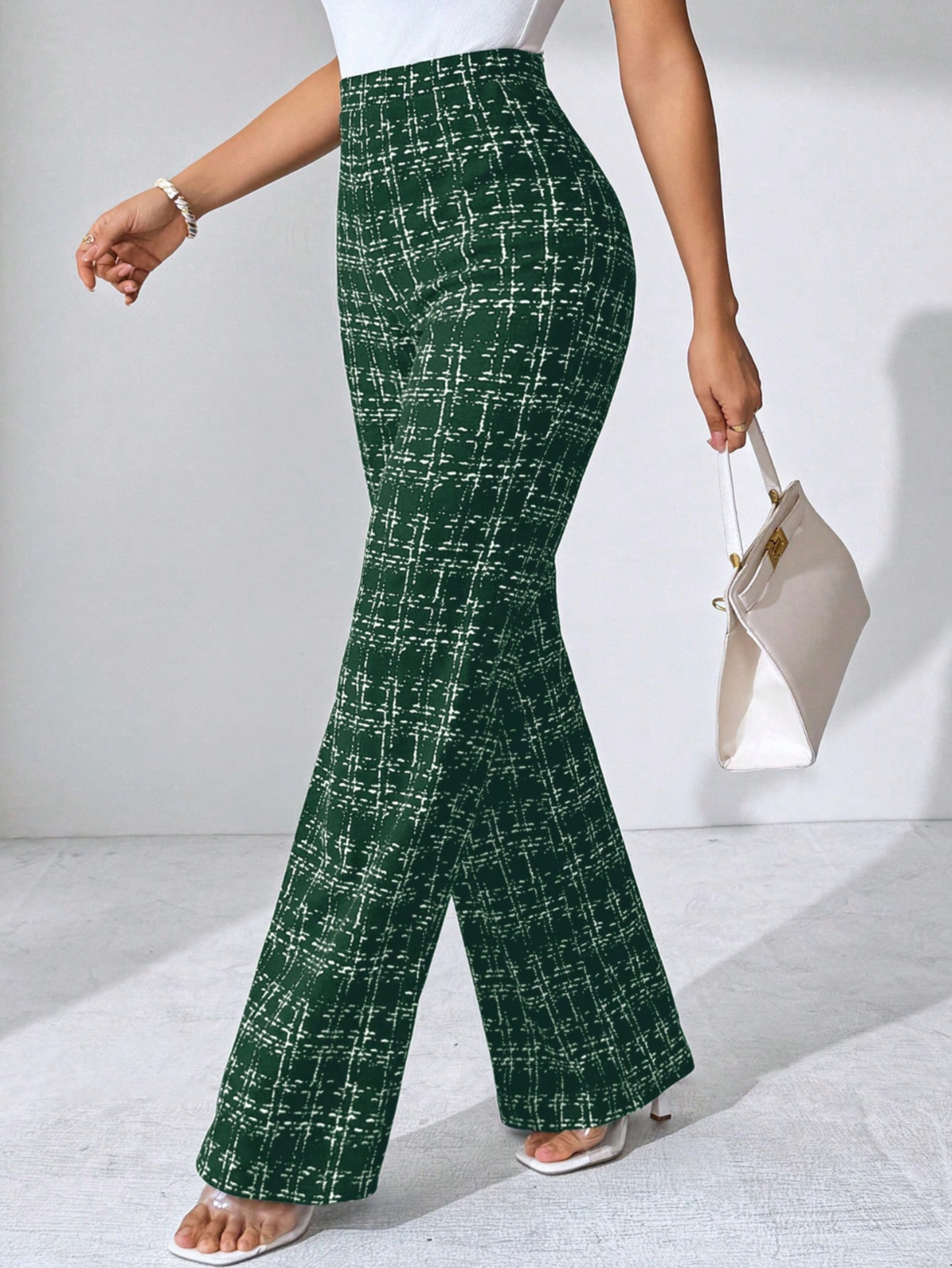 Chic women's high-waisted plaid flare pants, stretch knit for a comfortable and adaptable fit.
