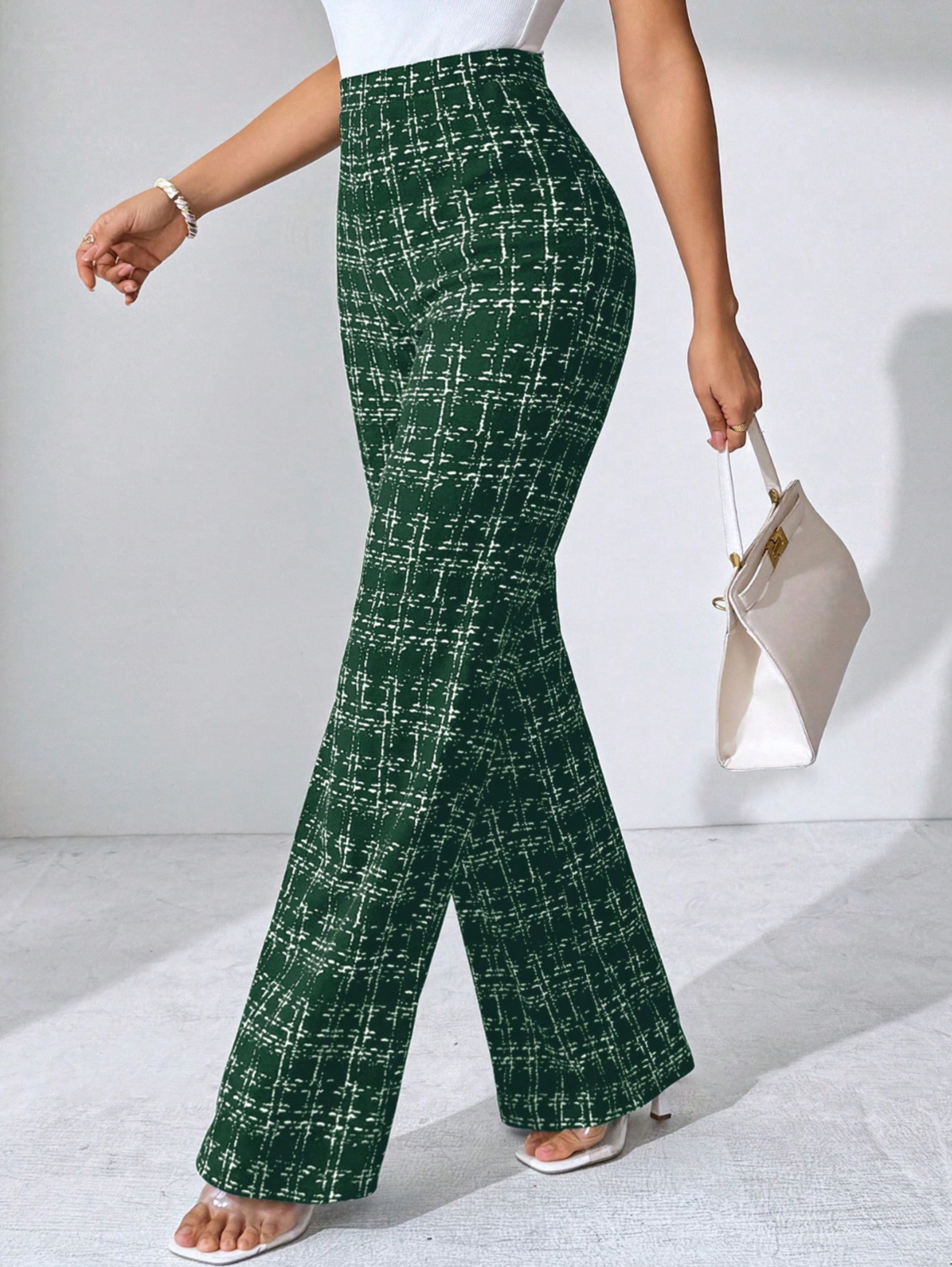 Chic women's high-waisted plaid flare pants, stretch knit for a comfortable and adaptable fit.