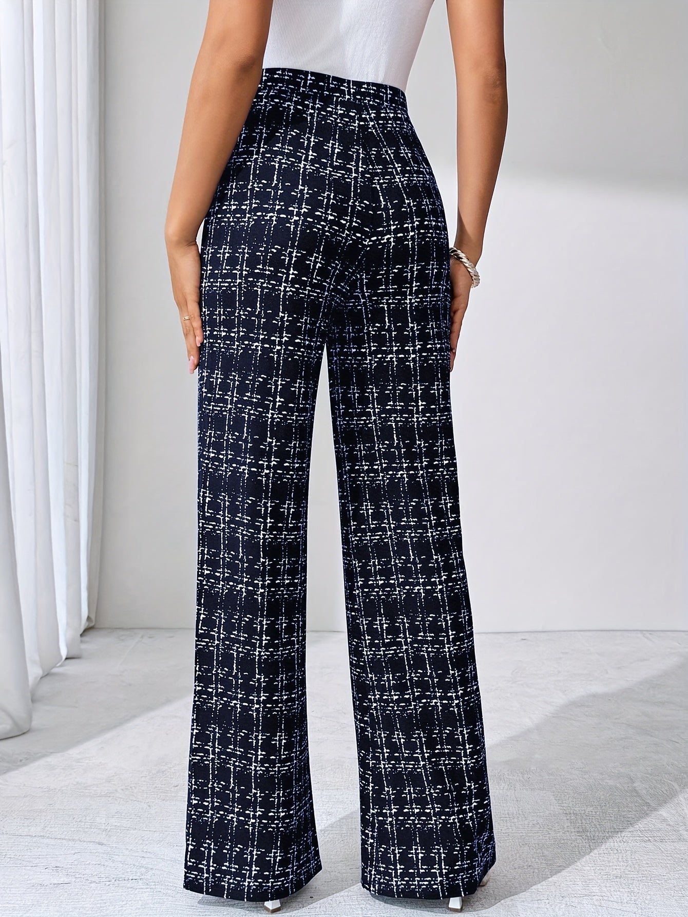 Versatile women's plaid flare pants, high-waisted, stretch knit, with a modern flared leg.