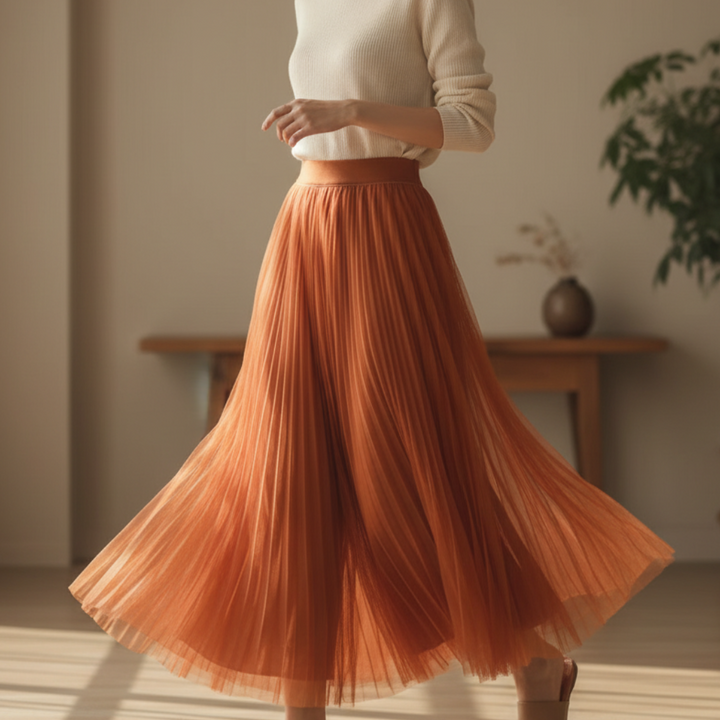 Women's high-waisted pleated midi skirt in an A-line style. Elegant and versatile for office wear or casual chic.