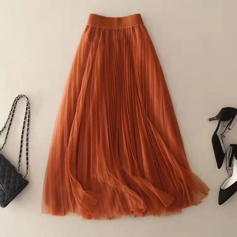 Versatile women's pleated A-line midi skirt, high-waisted for stylish spring and summer fashion looks.