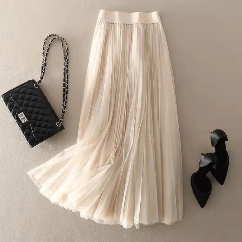 Casual chic women's high-waisted pleated midi skirt, A-line style, suitable for spring fashion & office.