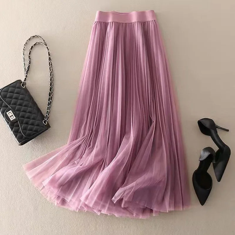 Flowy women's A-line pleated midi skirt, high-waisted and comfortable for stylish summer and spring fashion.