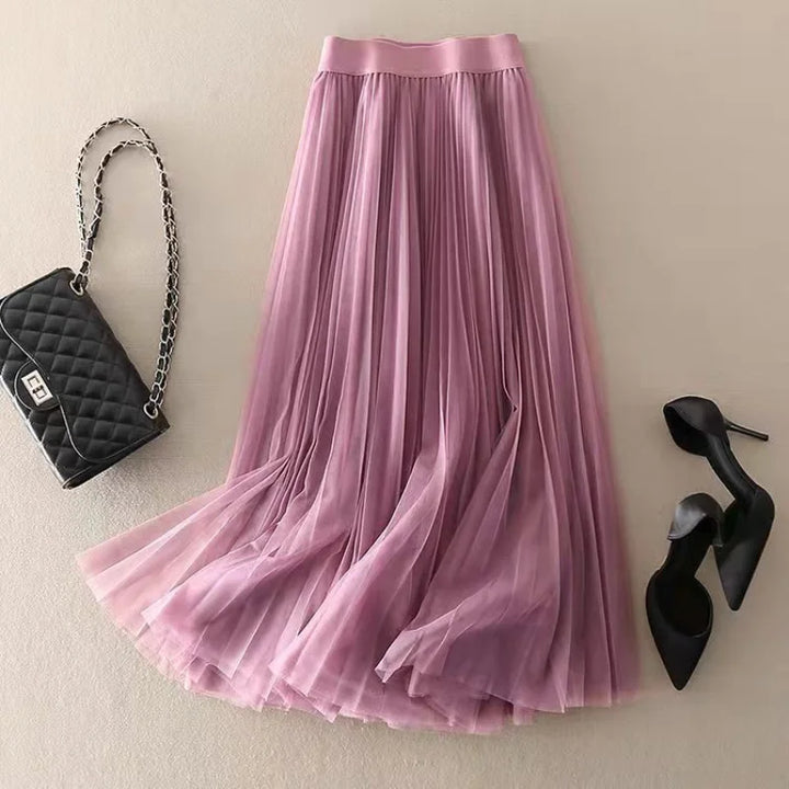 Flowy women's A-line pleated midi skirt, high-waisted and comfortable for stylish summer and spring fashion.