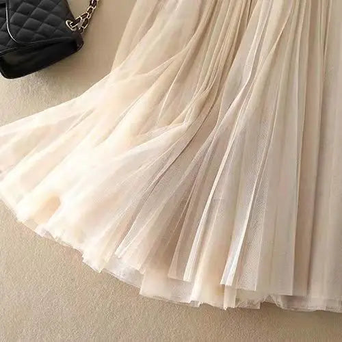 Elegant & versatile women's high-waisted pleated A-line midi skirt, ideal for office or casual chic outfits.