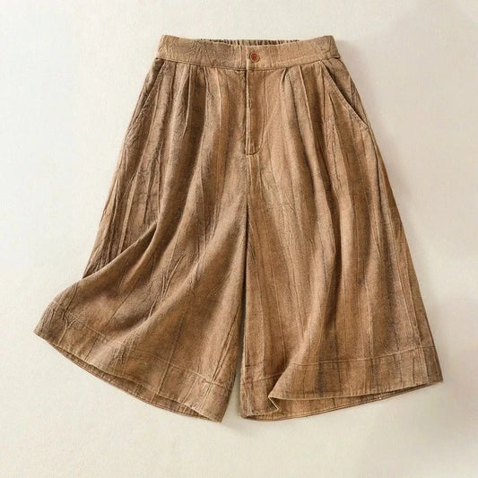 Women's high-waisted, pleated, relaxed fit tie-dye shorts, perfect for summer casual wear or vacation comfort.