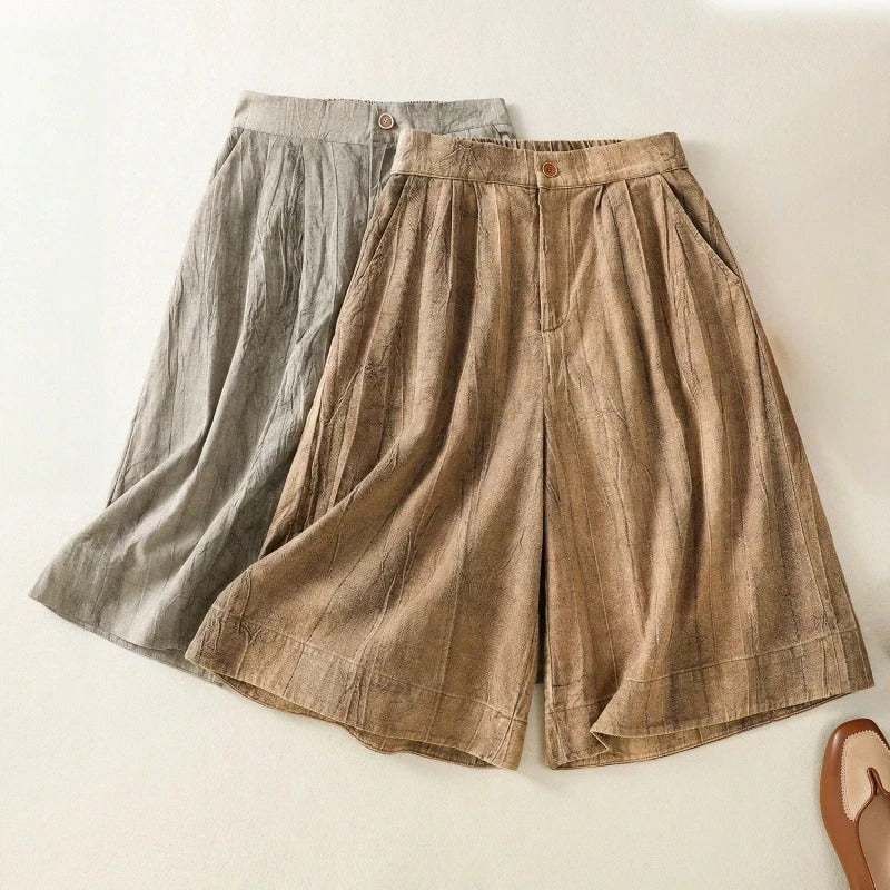Stylish women's tie-dye shorts featuring a high waist and pleated design for a relaxed, comfortable summer look.