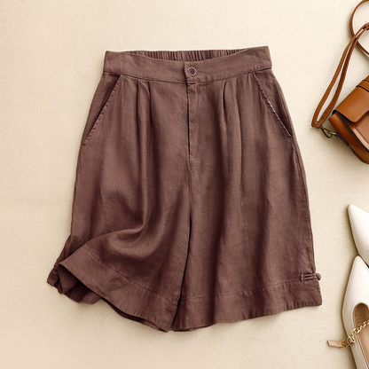 Women's high-waisted pleated summer shorts. Relaxed fit, perfect for casual wear & warm weather fashion.