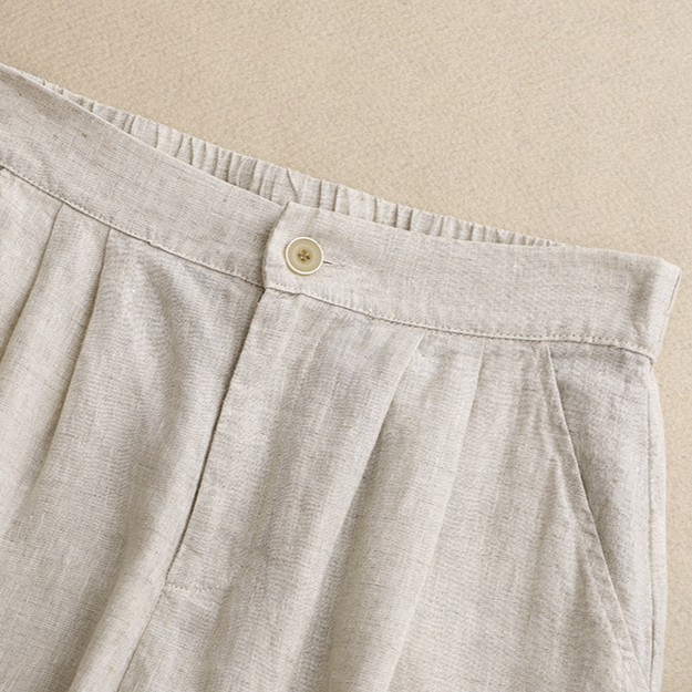 Women's high-waisted pleated summer shorts styled for a comfy, casual look. Perfect everyday warm weather fashion.