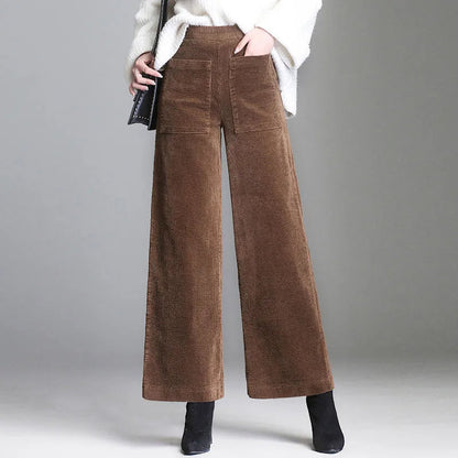 Stylish women's retro-inspired flare trousers featuring distinctive high-waisted design & patch pockets.