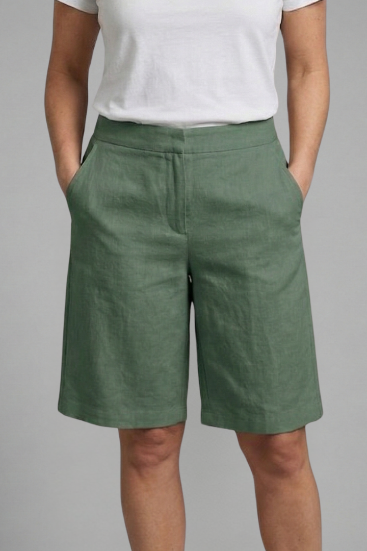 Chic high-waisted tailored shorts for women, featuring a relaxed fit and practical pockets for warm weather style.