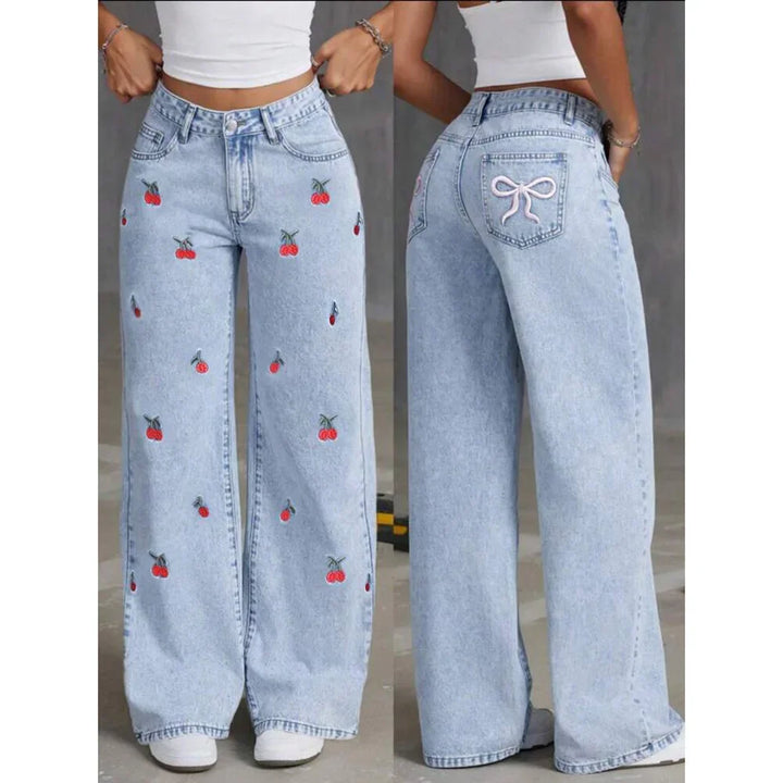 Trendy high-waisted wide-leg women's jeans in light wash denim, adorned with cute cherry embroidery.
