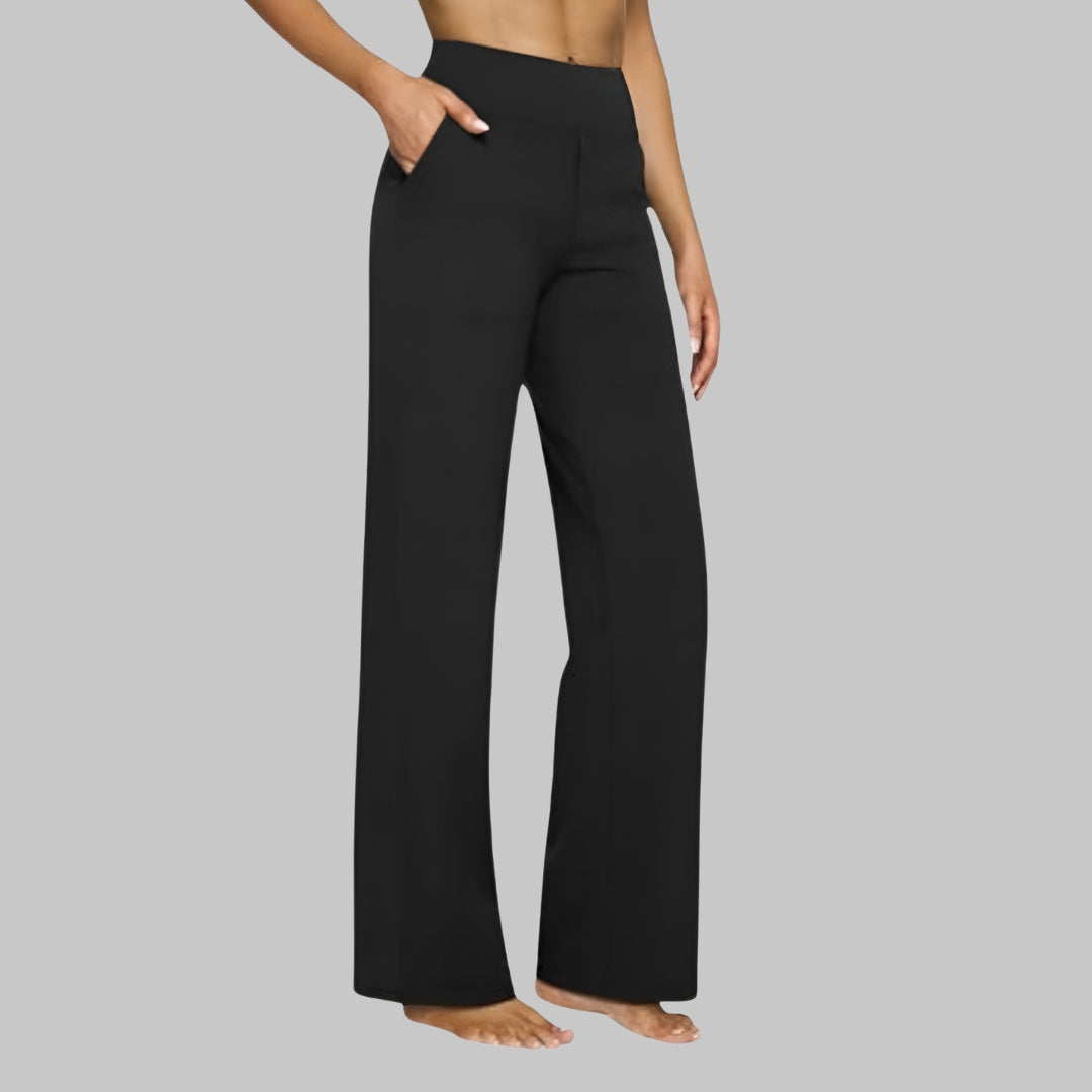Full shot of women's wide-leg pants, high-waisted, paired with a simple top for casual comfort.