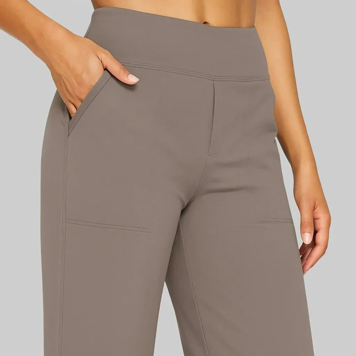 Trendy women's high-waisted wide-leg pants, showcasing spacious side pockets for essentials.