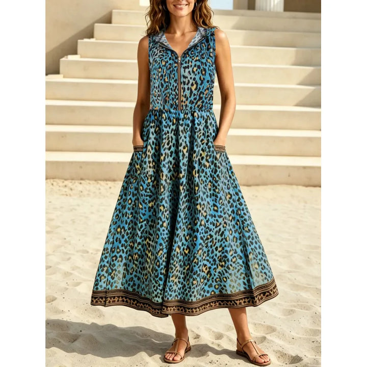 Flowy leopard print maxi dress for women, featuring a hood, front zipper, and practical pockets. Comfortable summer style.