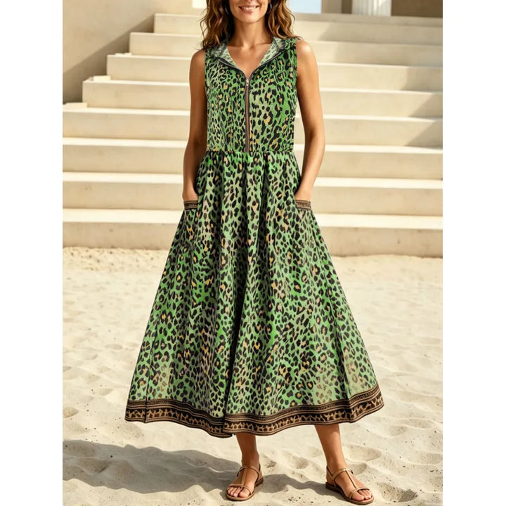 Comfortable women's sleeveless hooded leopard print maxi dress with zipper and pockets. Ideal flowy summer casual dress.