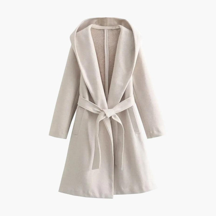 Durable women's trench coat, hooded and belted, providing stylish protection against rain.