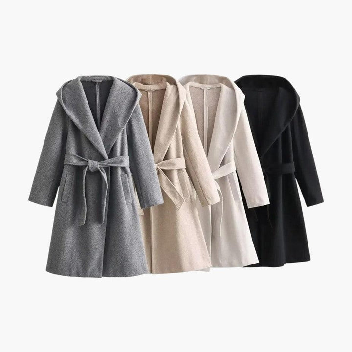Practical yet stylish women's hooded trench coat, perfect for rainy days and a polished look.